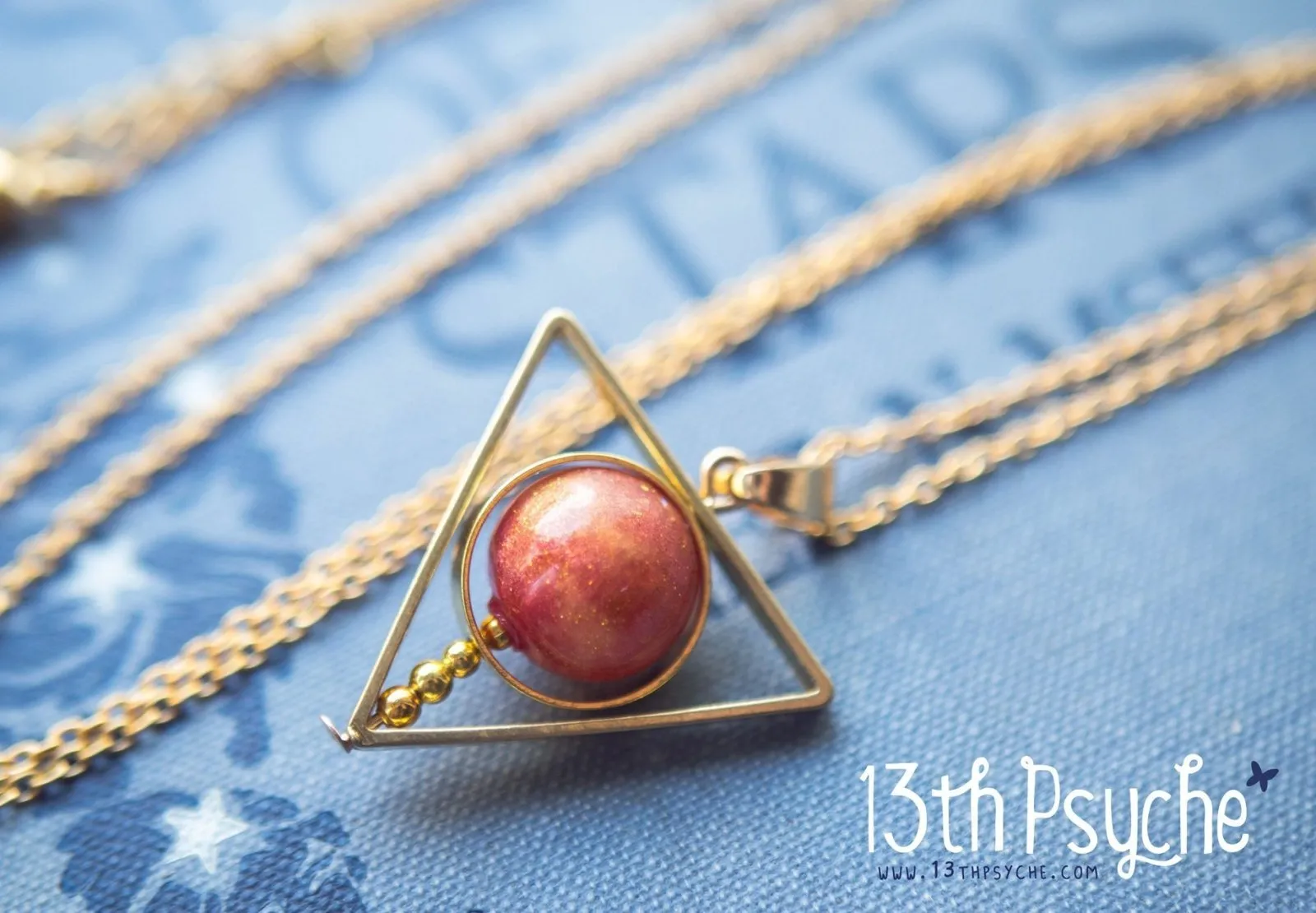 Sun star inspired triangle spinner necklace